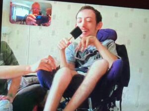 Service user enjoys online session